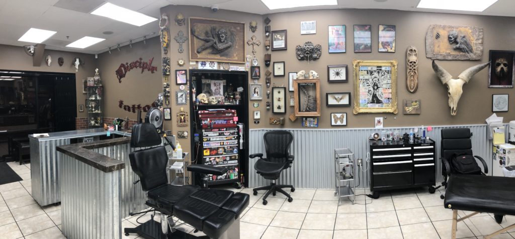 A barber shop with many items on the wall.